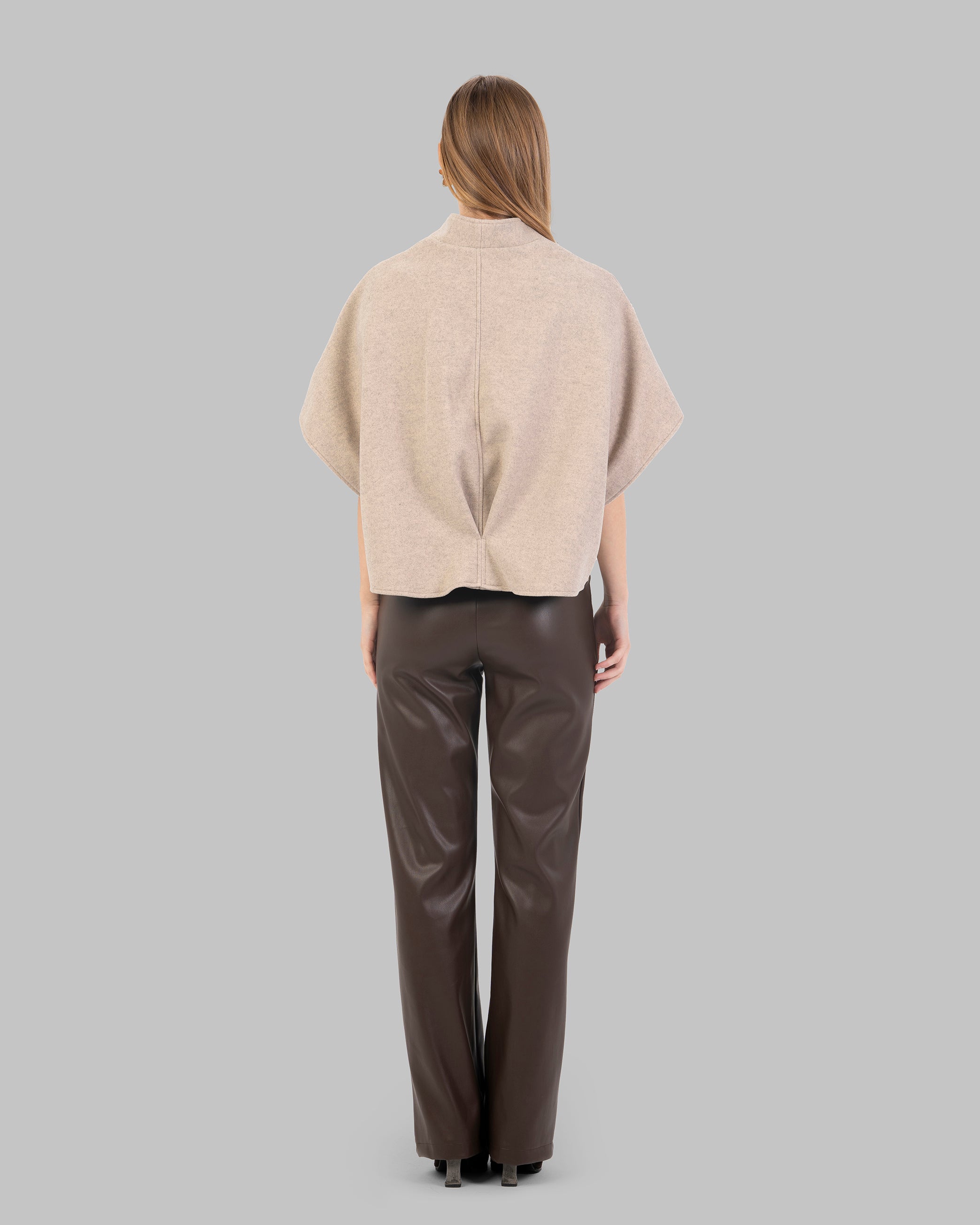 "Short Wool-Blend Cape Jacket With Patch pocket."