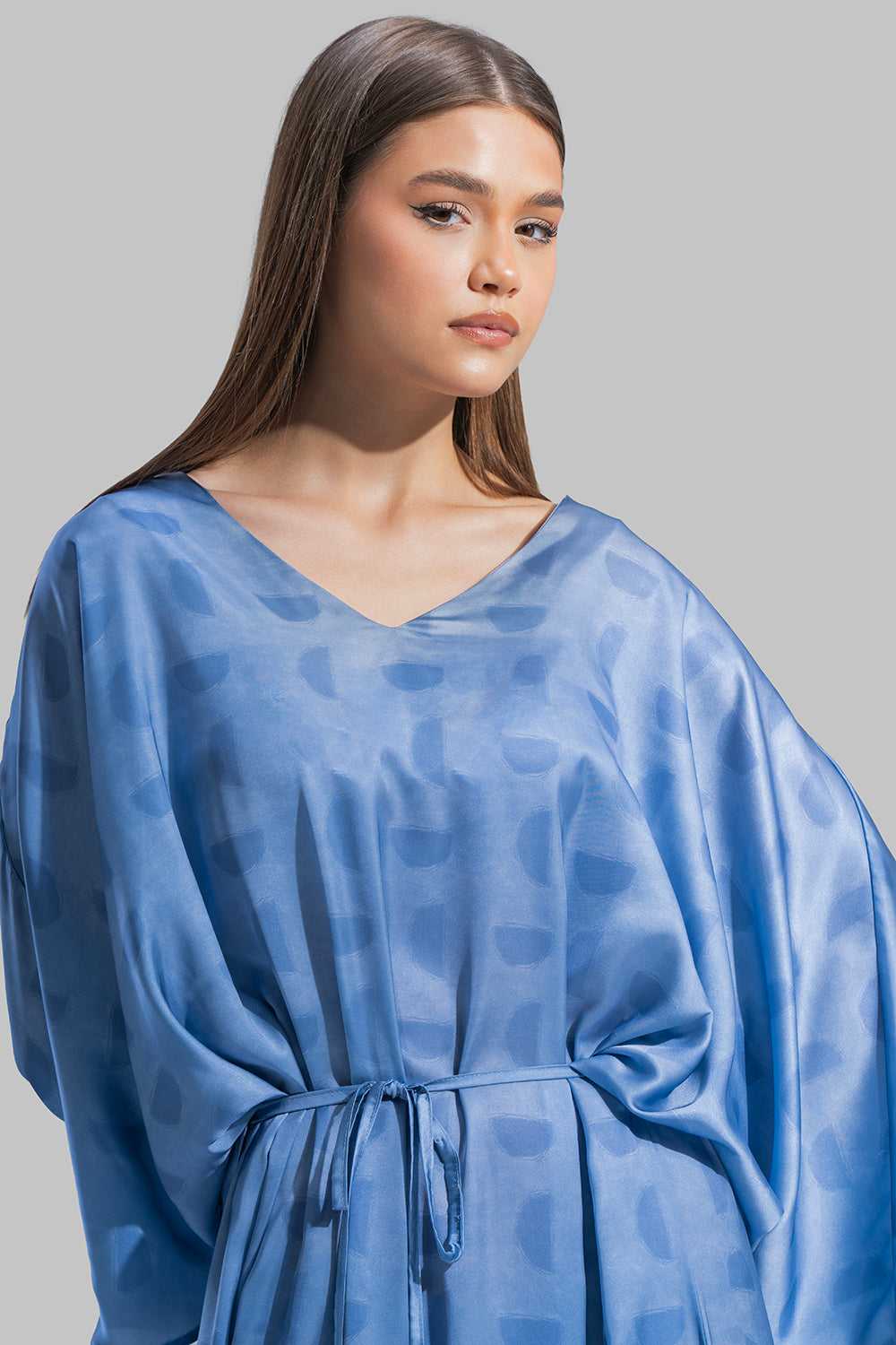 Oversized maxi dress featuring a V-neckline and wide kimono-style sleeves.