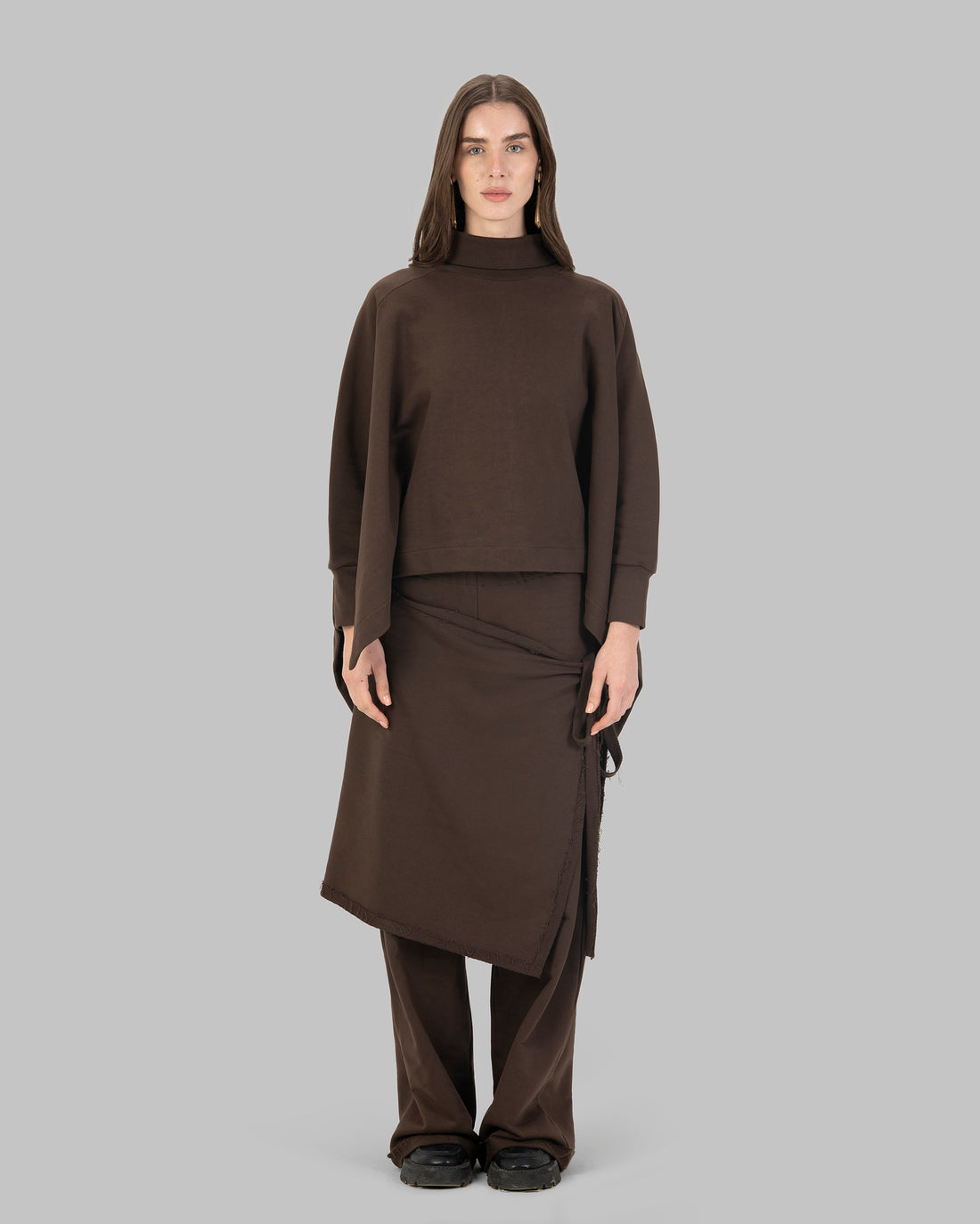 Wide-leg pants with an attached wrap-over skirt panel.