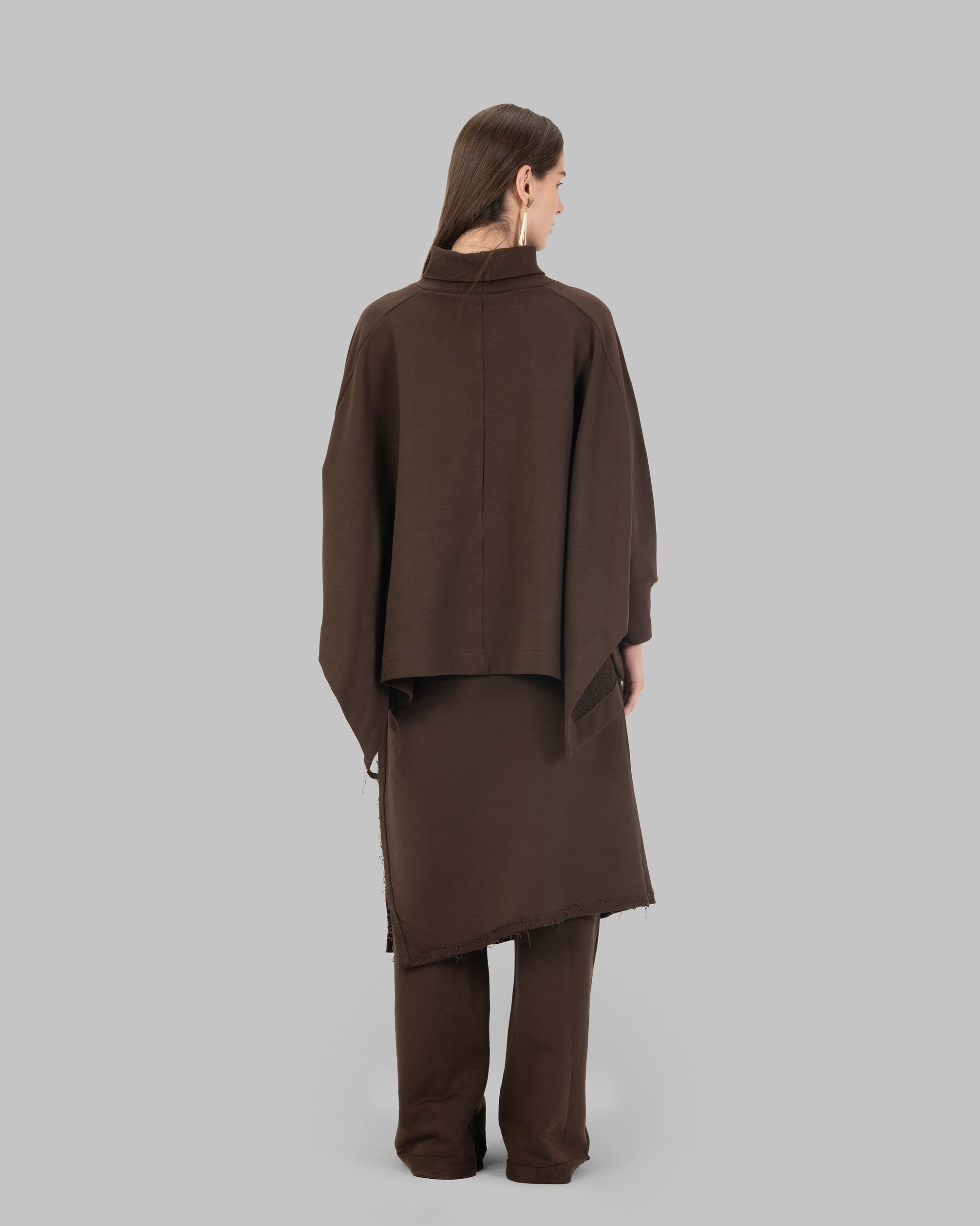 Loose-fit poncho-style top made of soft fabric.