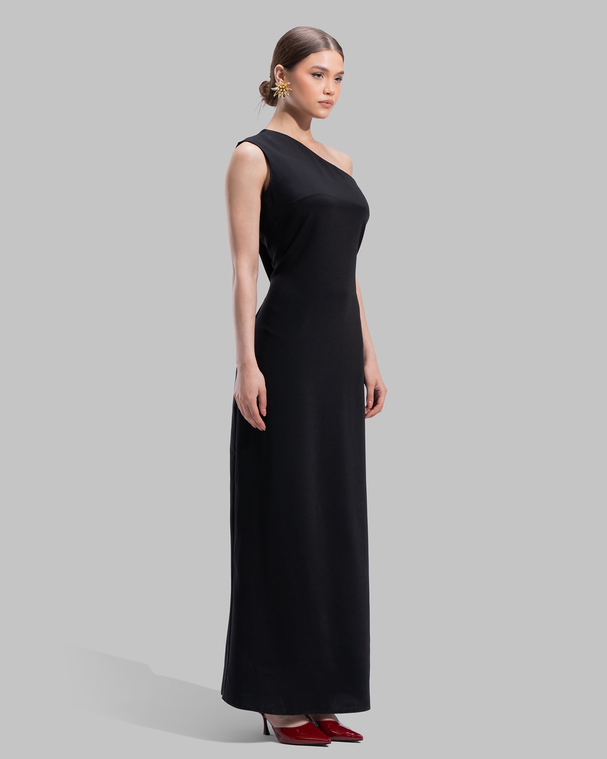 Draped asymmetrical neckline satin maxi dress with a fluid oversized silhouette.