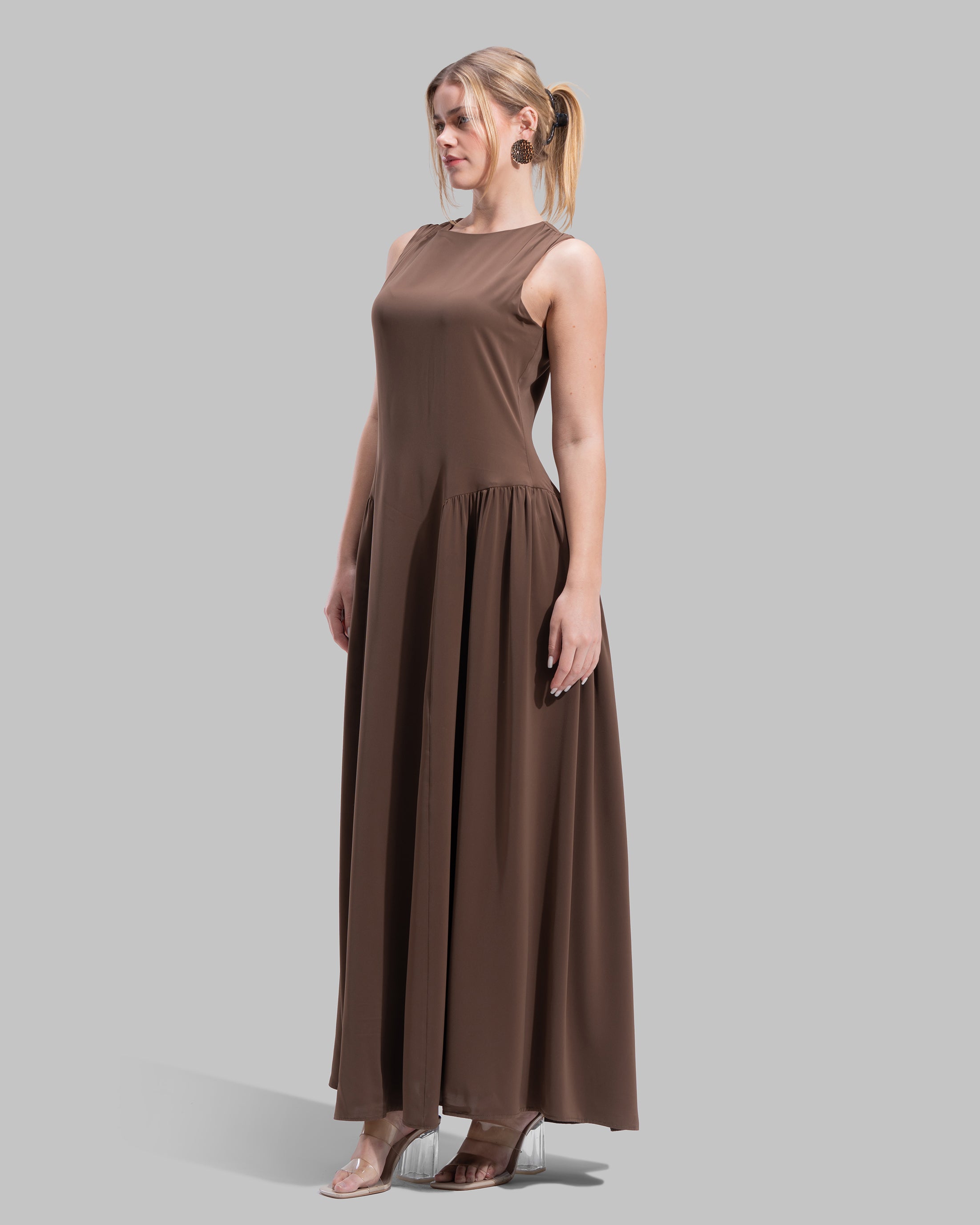 Sleeveless long dress with a round neckline.