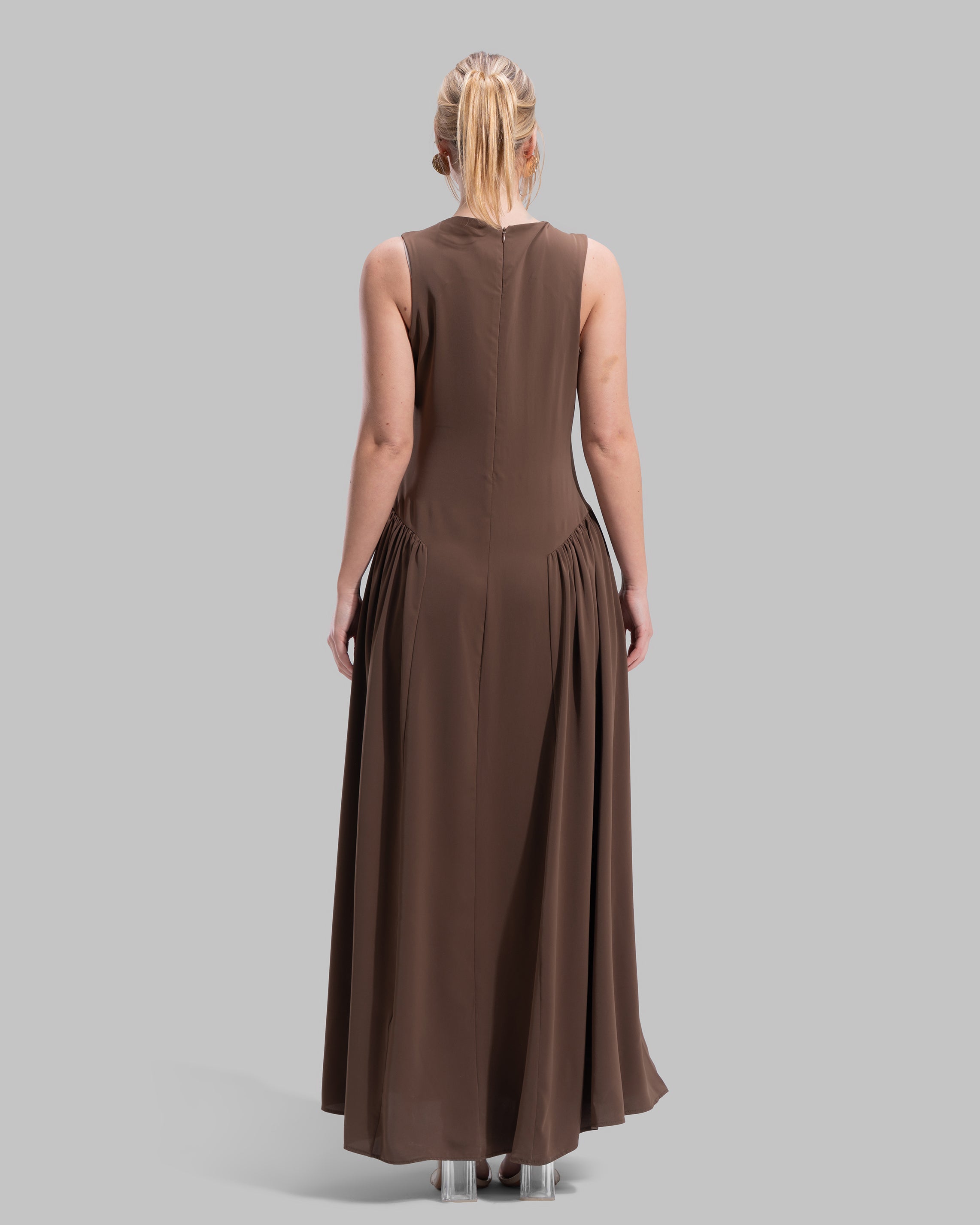 Sleeveless long dress with a round neckline.
