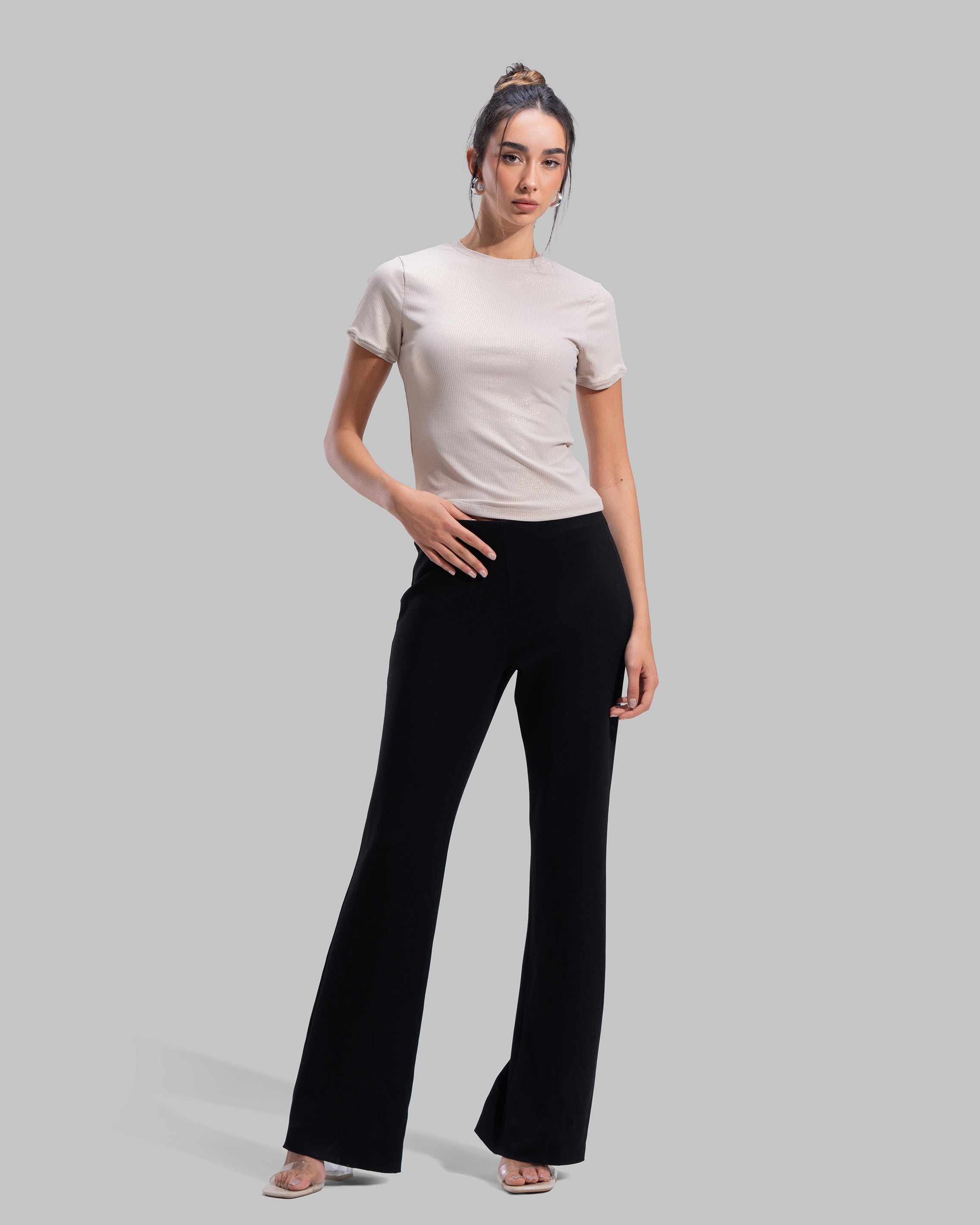 Short sleeve ribbed top with a shimmering metallic finish and round neck.