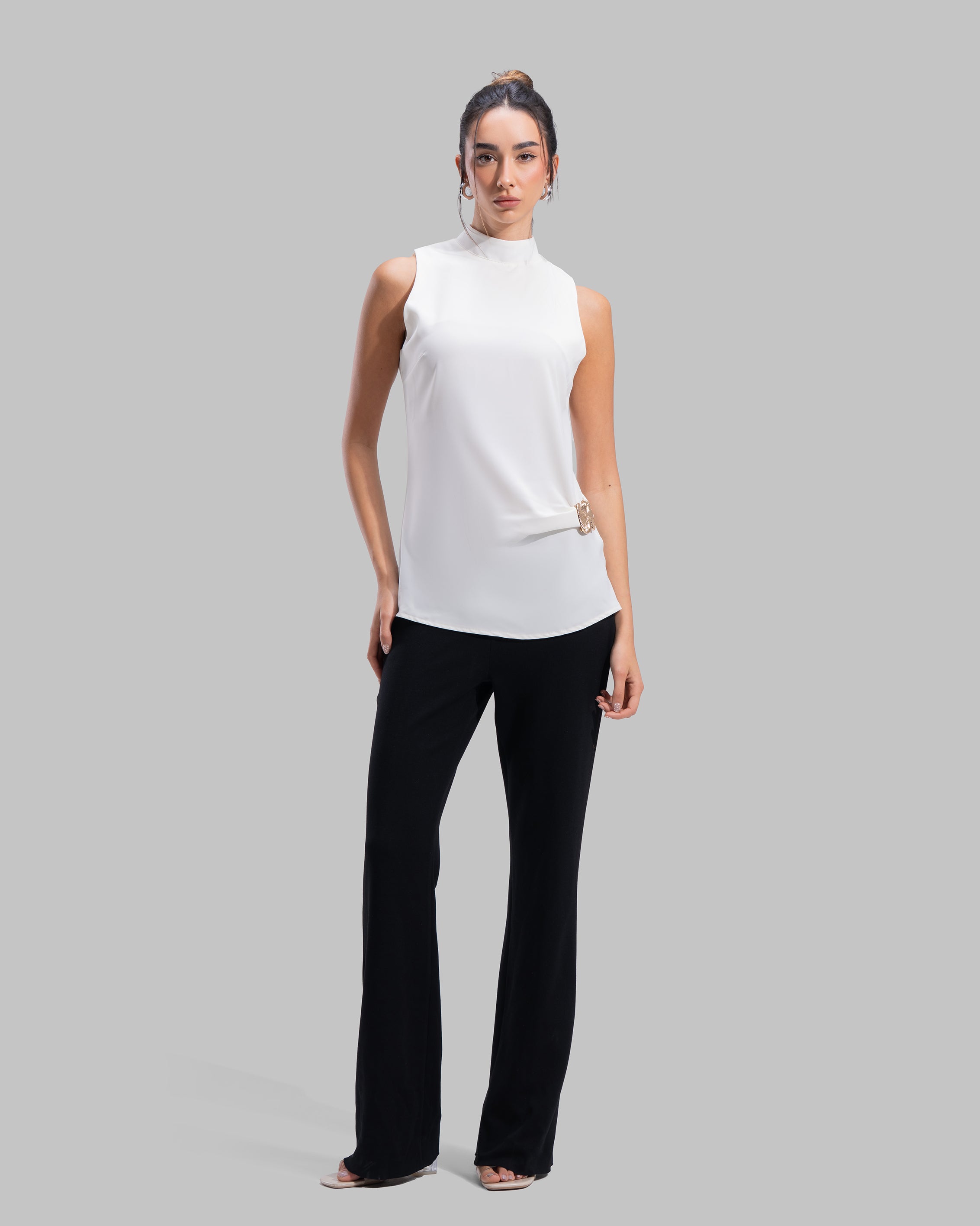 Sleeveless ribbed tank top with a metallic thread finish and a round neck.