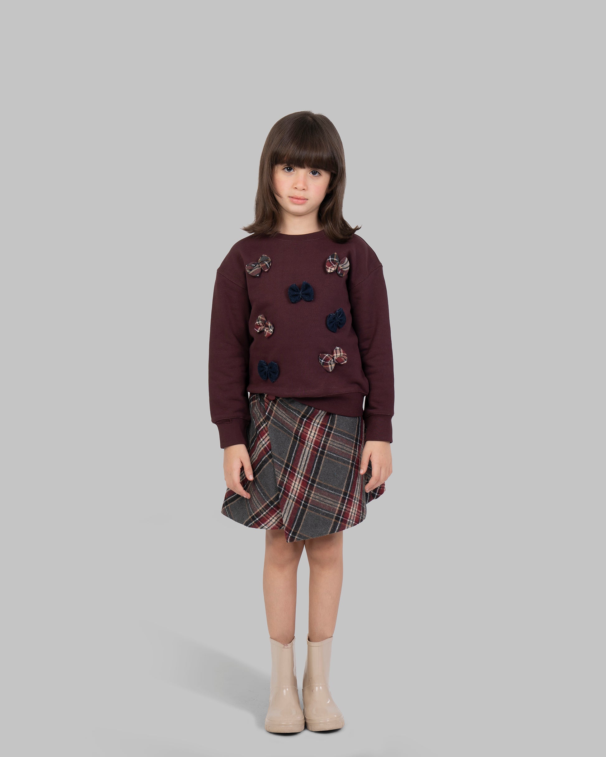 Short wrap-style skirt in a wool-blend plaid fabric