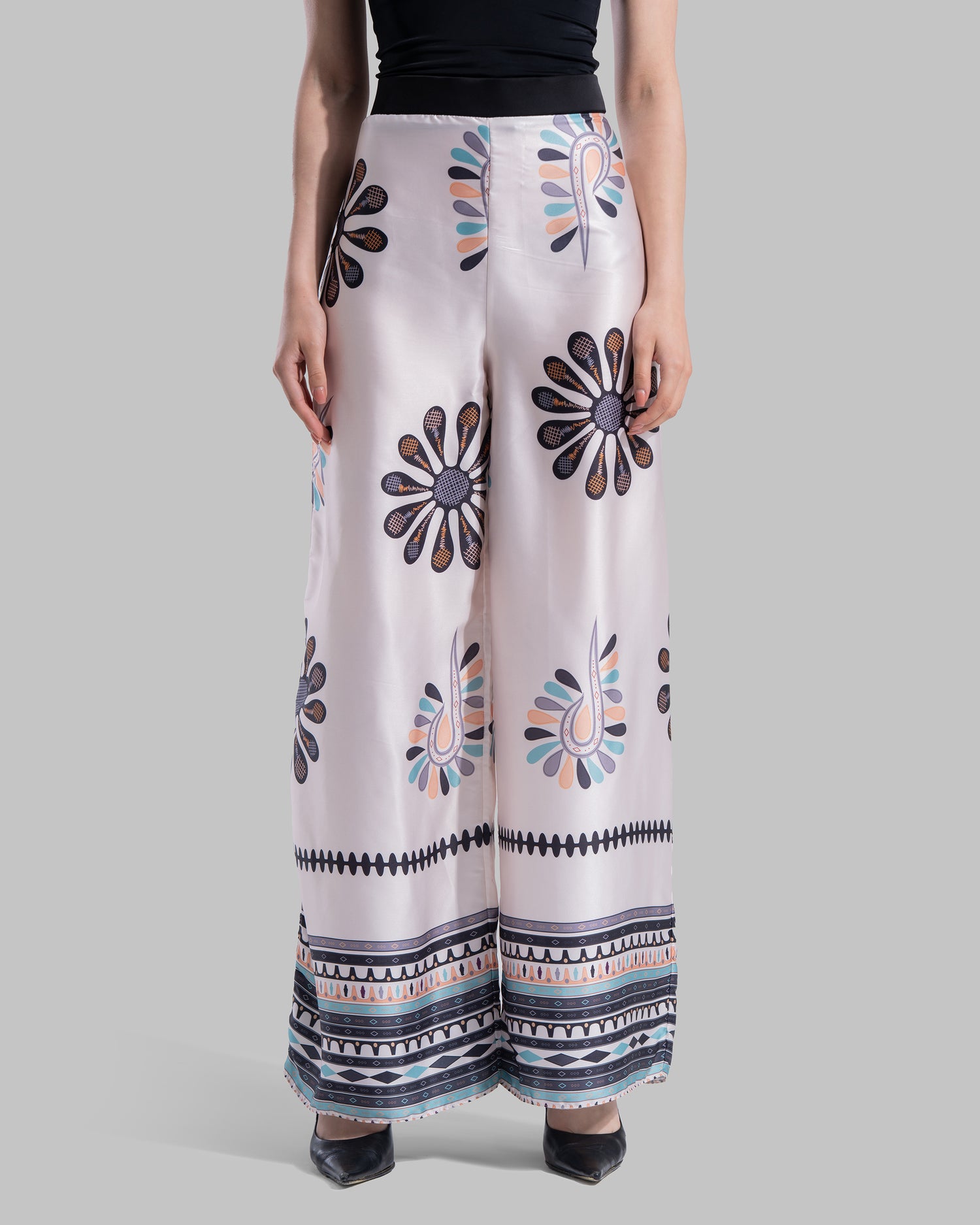 High-waist wide-leg pants with elastic waistband and Boho Sunburst graphic print.