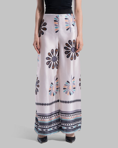 High-waist wide-leg pants with elastic waistband and Boho Sunburst graphic print.