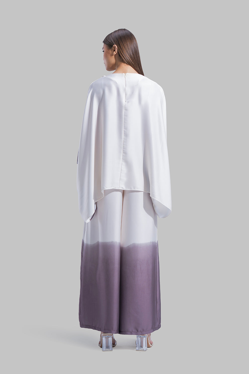 Draped asymmetrical blouse with a side-split design.