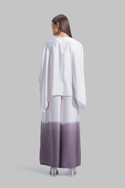 Draped asymmetrical blouse with a side-split design.
