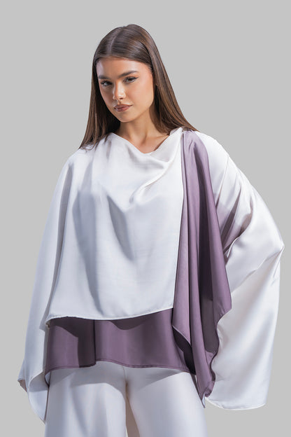 Draped asymmetrical blouse with a side-split design.