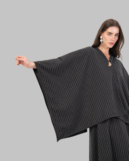 pinstripe poncho with a V-neck and an asymmetric hem.