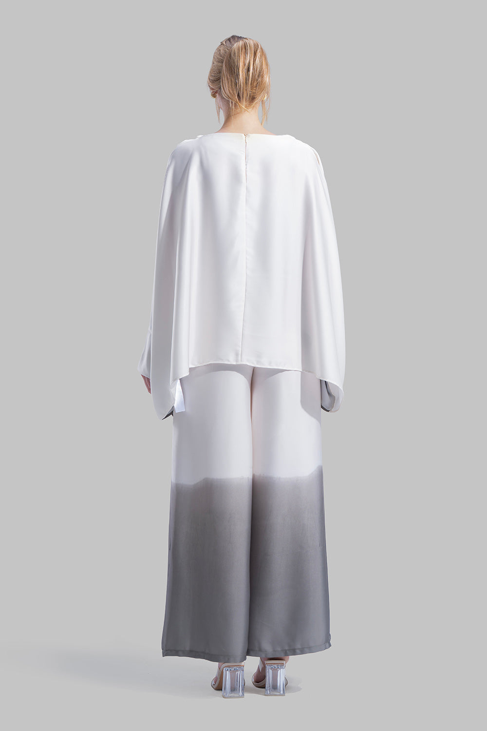 Draped asymmetrical blouse with a side-split design.