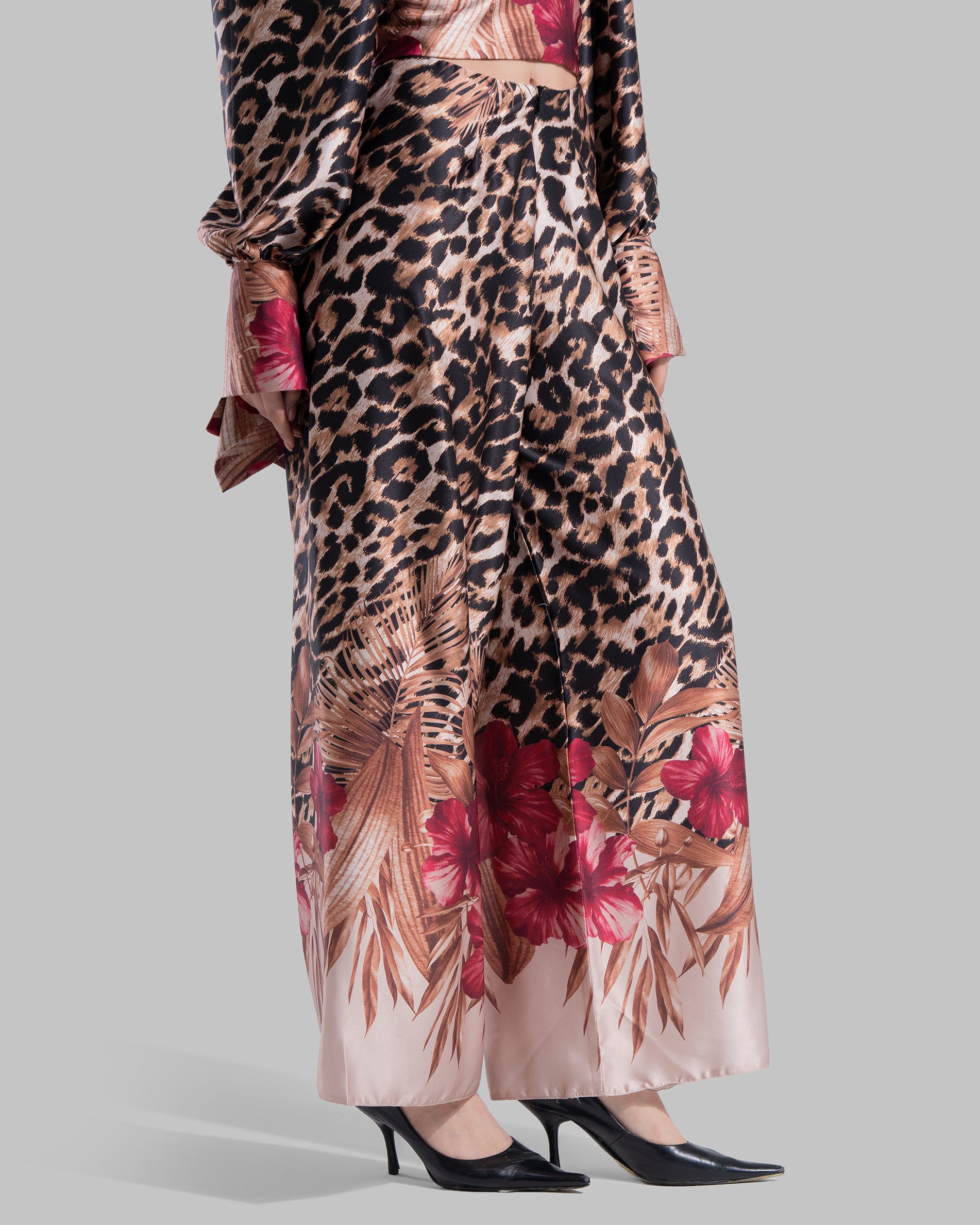 Long sleeve top with a draped neckline and slightly puffed shoulders.