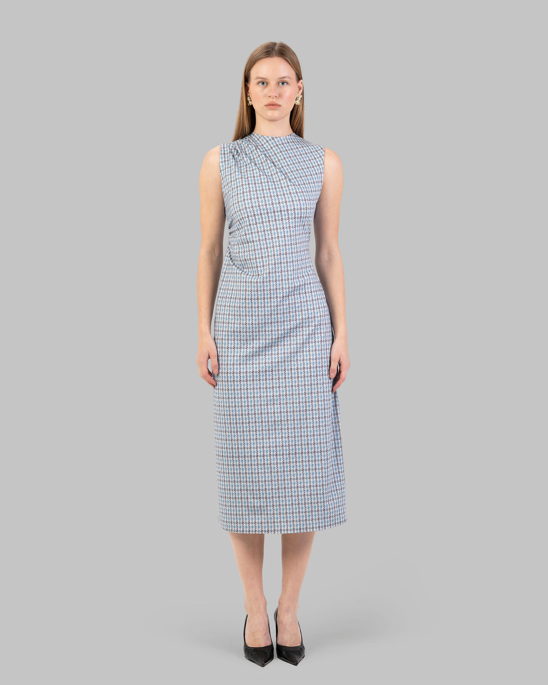 fitted dress with a pink and black houndstooth pattern.