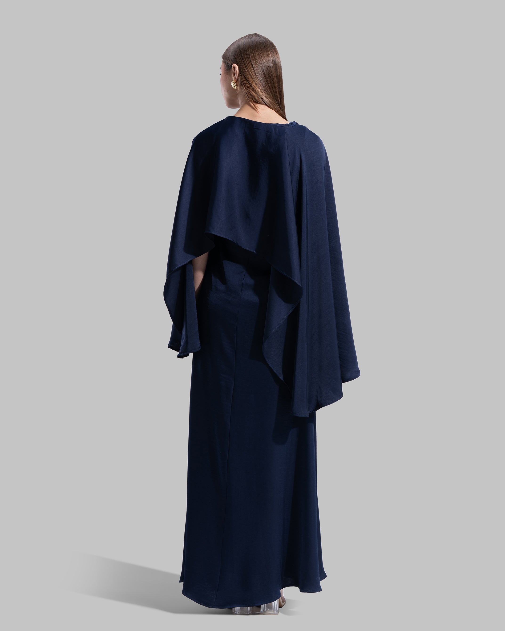 Long dress made of a flowing satin-finish fabric.