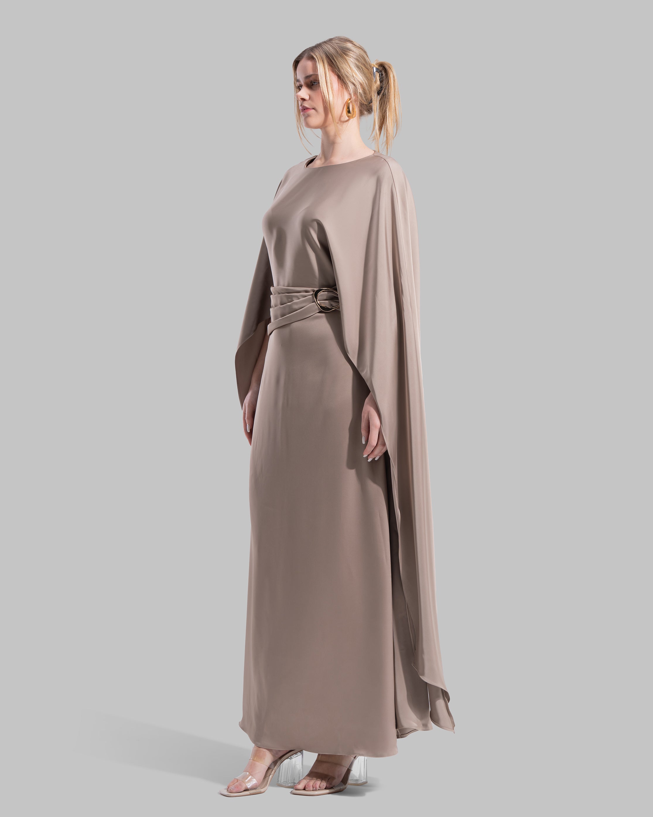 An elegant satin gown of sweeping length