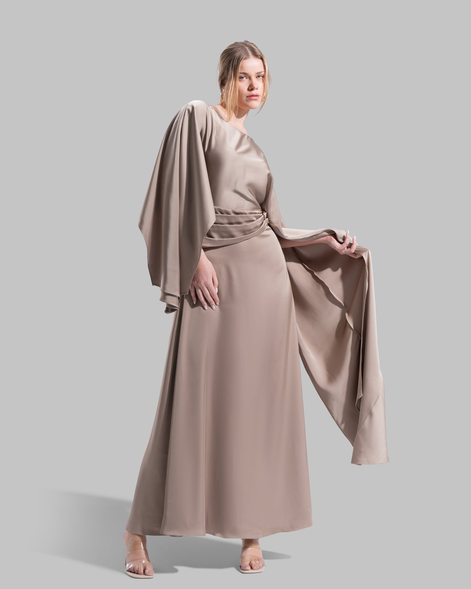 An elegant satin gown of sweeping length