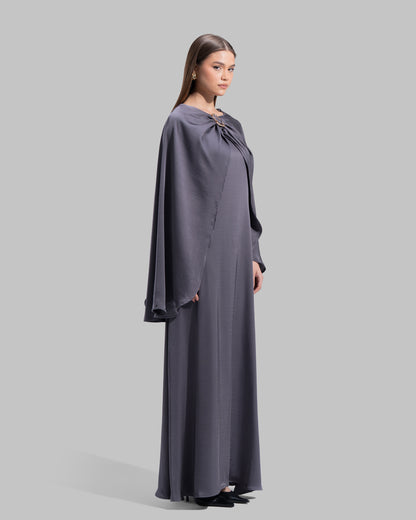 Long dress made of a flowing satin-finish fabric.