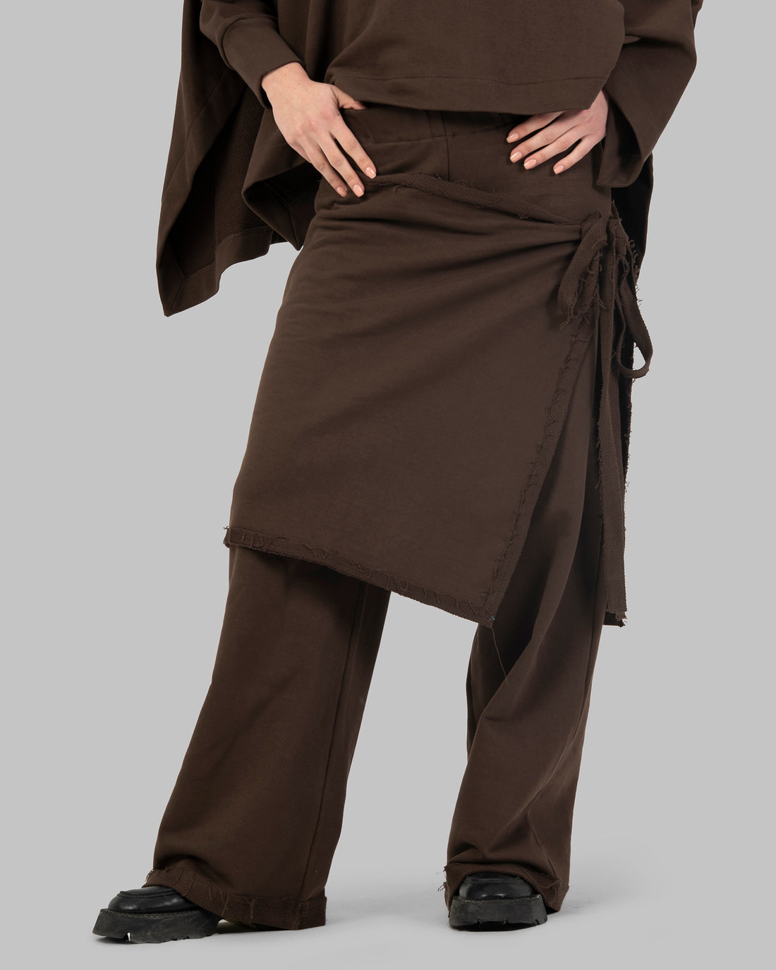 Wide-leg pants with an attached wrap-over skirt panel.