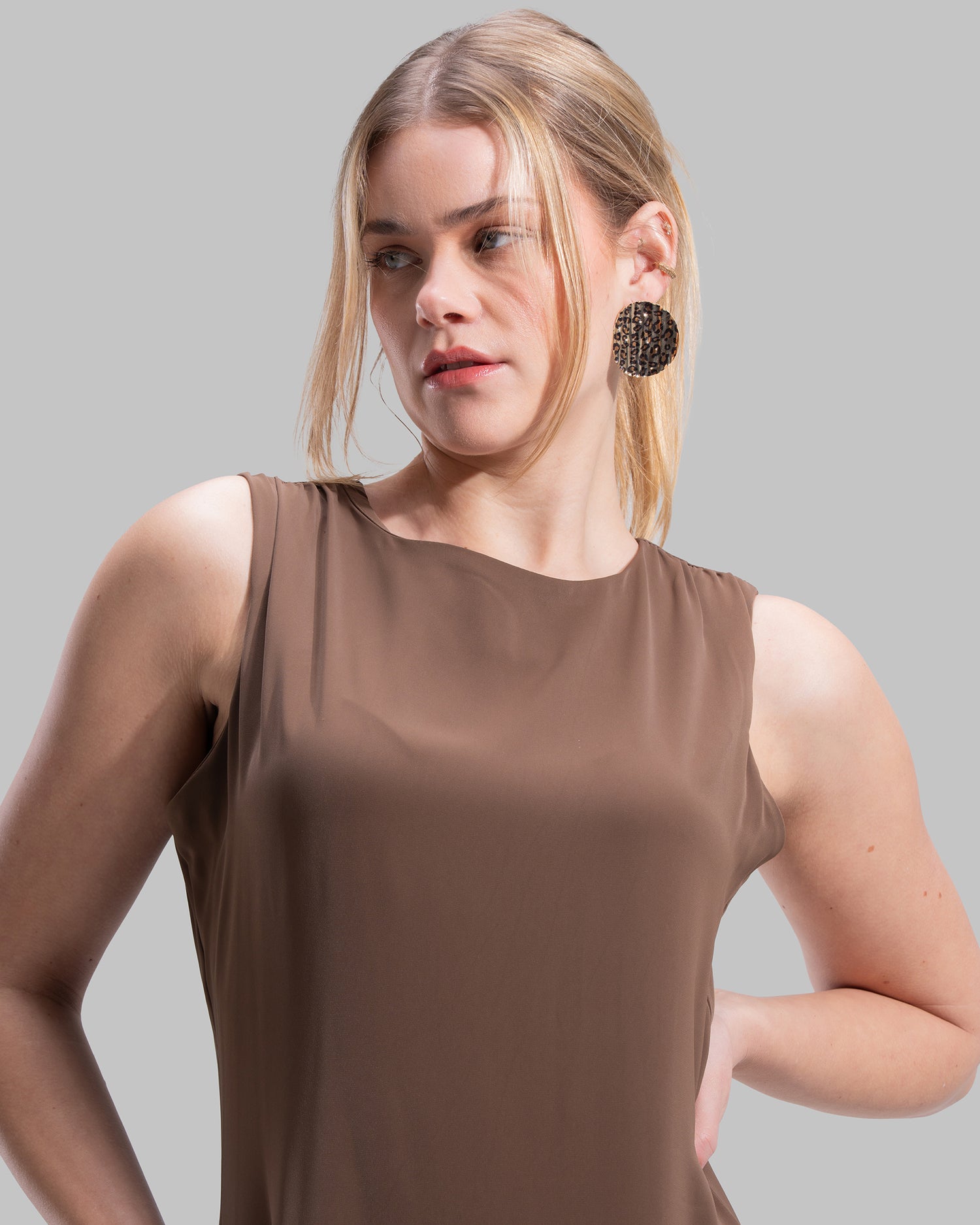 Sleeveless long dress with a round neckline.