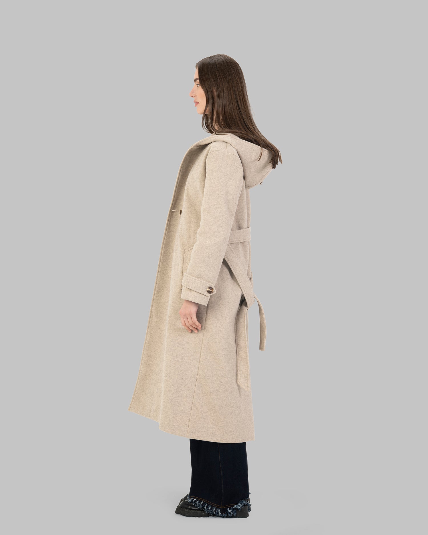 Long hooded coat in light beige with a belt waist