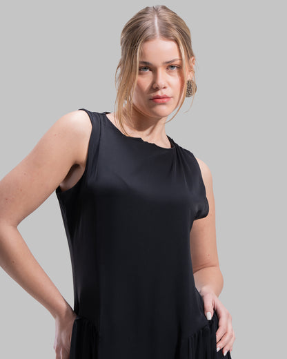 Sleeveless long dress with a round neckline.