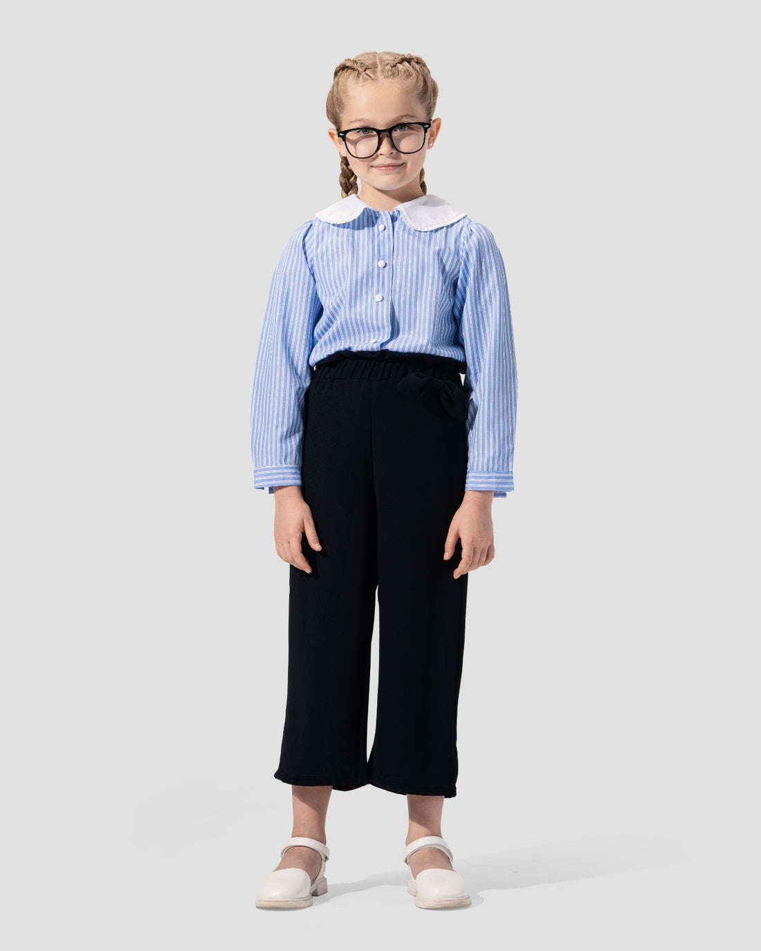 Wide-leg culotte trousers in navy blue with a high waist and side tie detail.