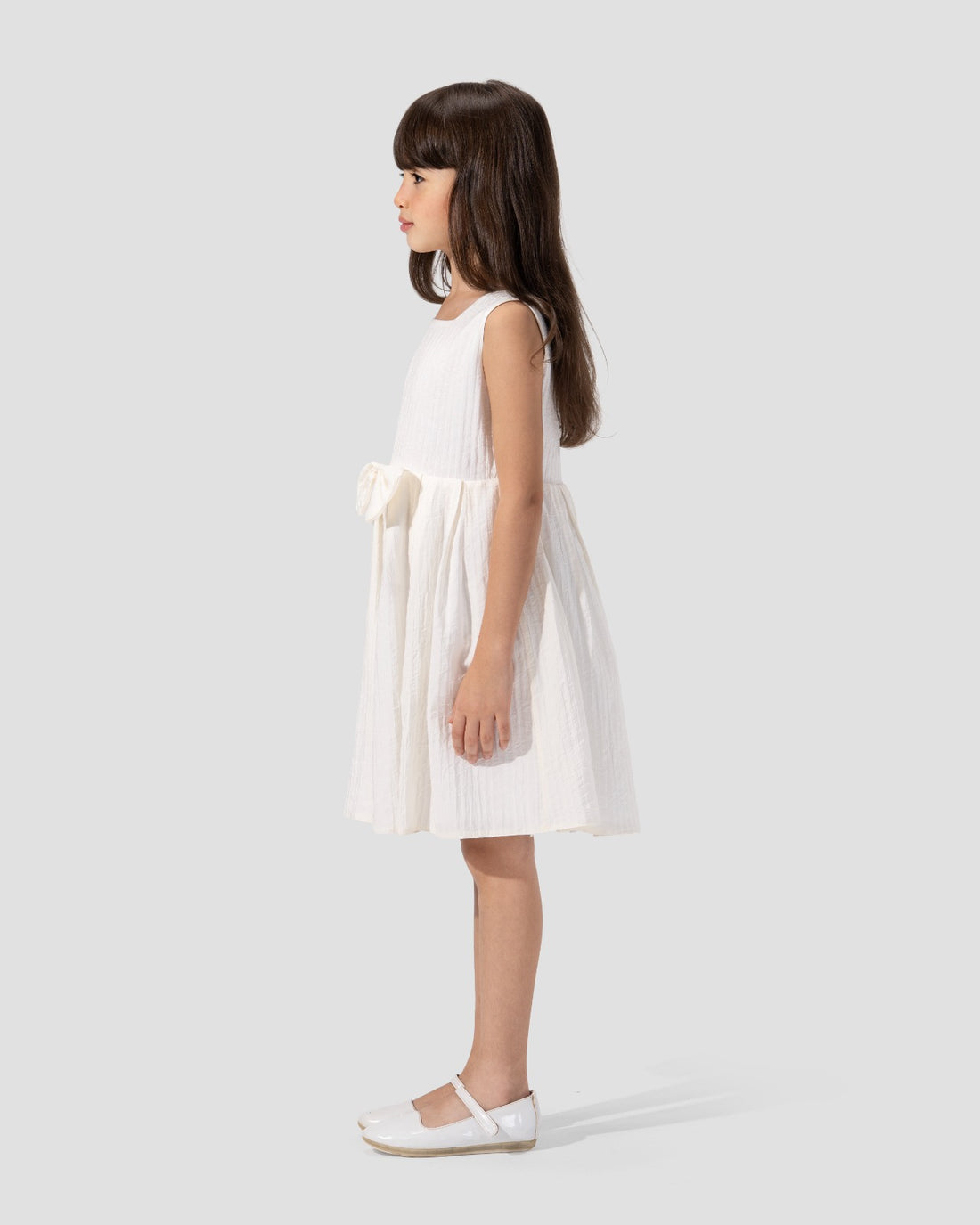 Textured sleeveless dress with a round neckline and a flared skirt