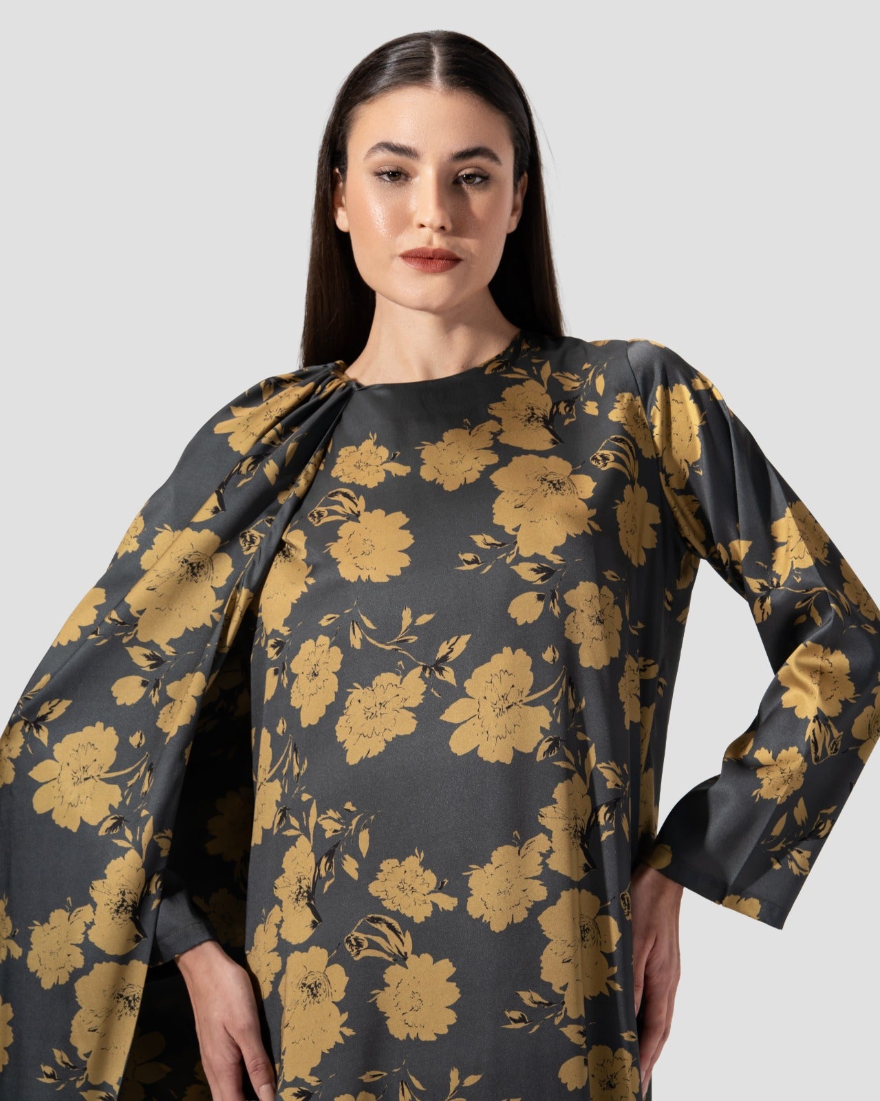 loose dress with a floral print of golden flowers .