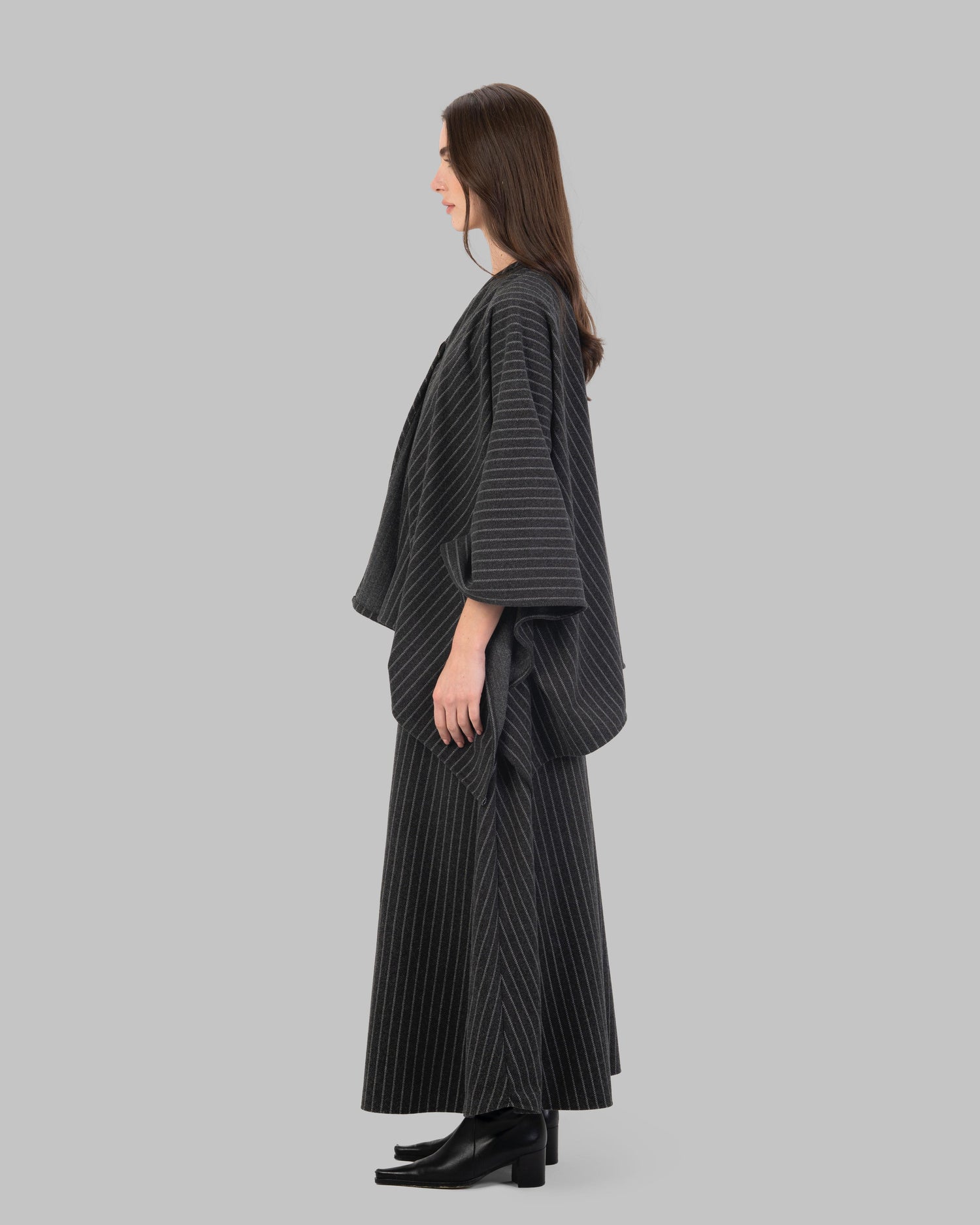 pinstripe poncho with a V-neck and an asymmetric hem.